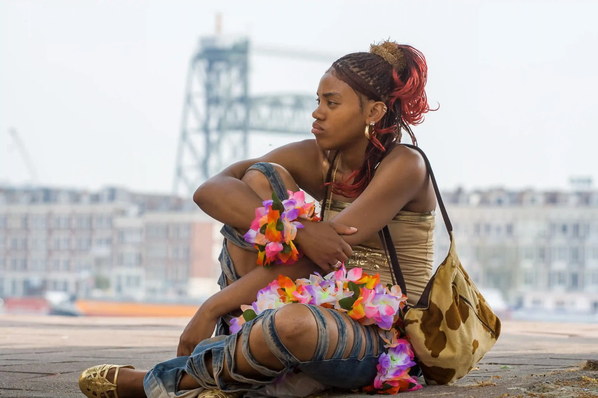 Candid shot of a girl at Zomercarnavl with in the background de Hef in Rotterdam.